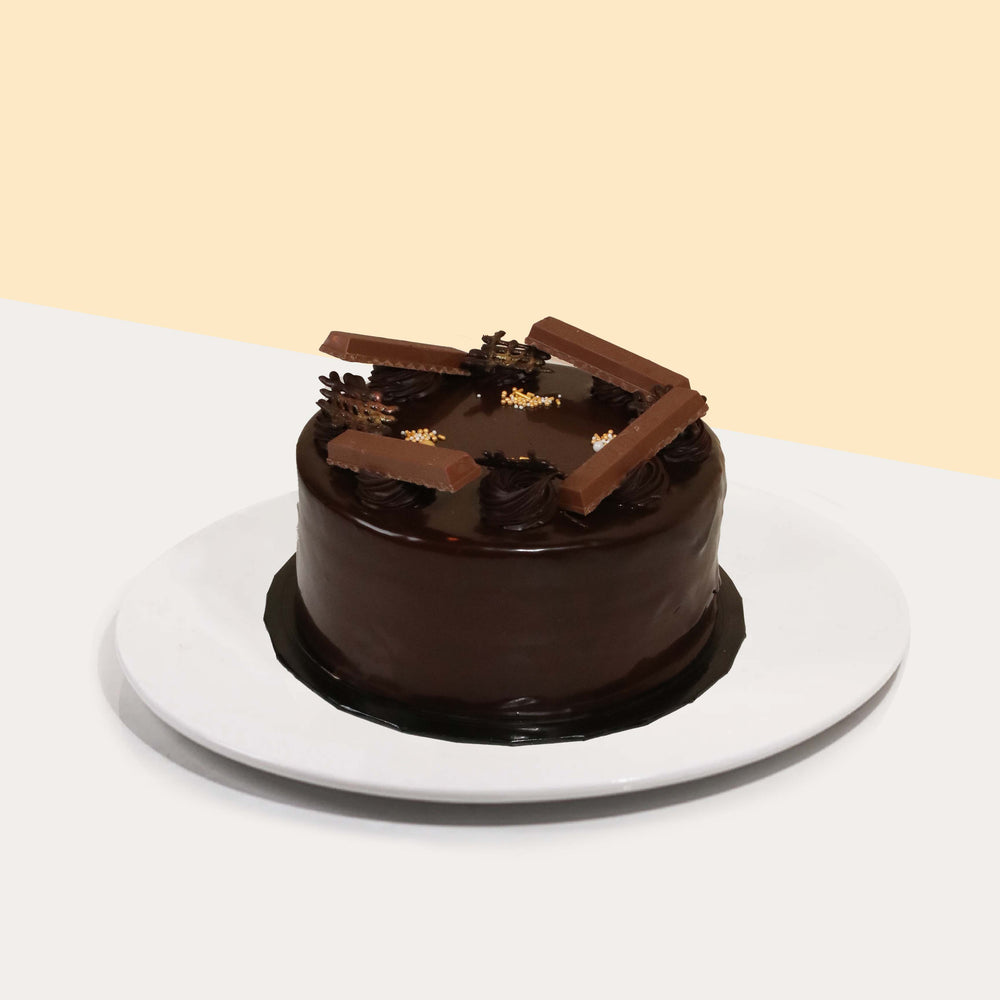 Chocolate sponge cake layered with chocolate ganache, KitKat chocolate, and chocolate chantilly cream