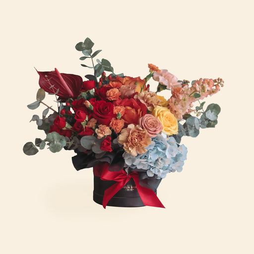 Flower box consisting of colorful Kenya Roses, Spray Roses, Hydrangea, Anthurium, Phalaenopsis, Matthiola, Carnation, Delphinium