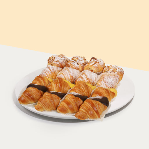 Assorted croissants with chocolate mousse, almonds, custard and lemon curd fillings