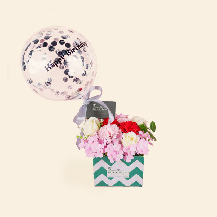 Soap flowers of carnation and roses, with a bubble balloon filled with confetti
