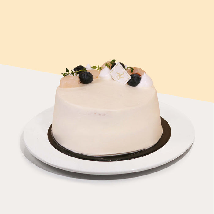 Lychee syrup soaked sponge cake, layered with cream and topped with fresh lychees