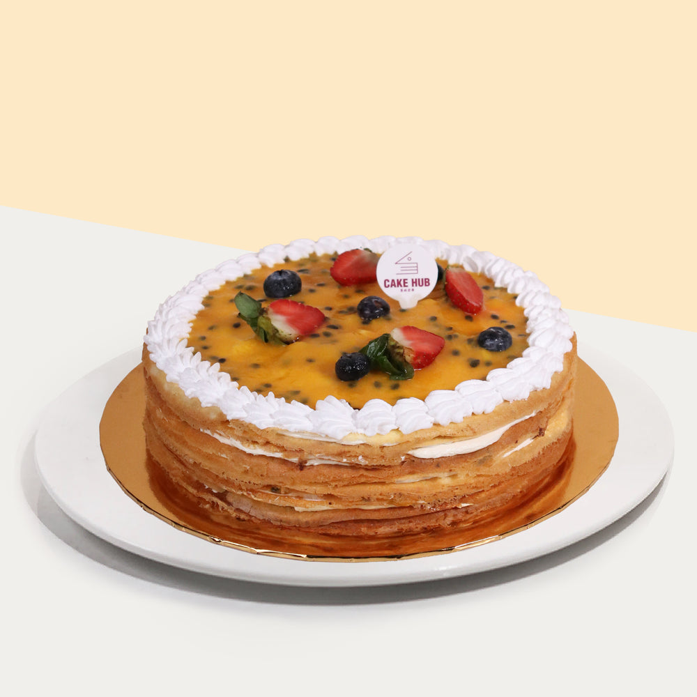 Mango and passion fruit mille crepe topped with passion fruit puree
