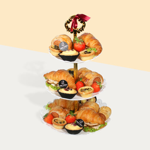 High tea platter with stand included, with croissants, tarts, quiche, sausage rolls and strawberries