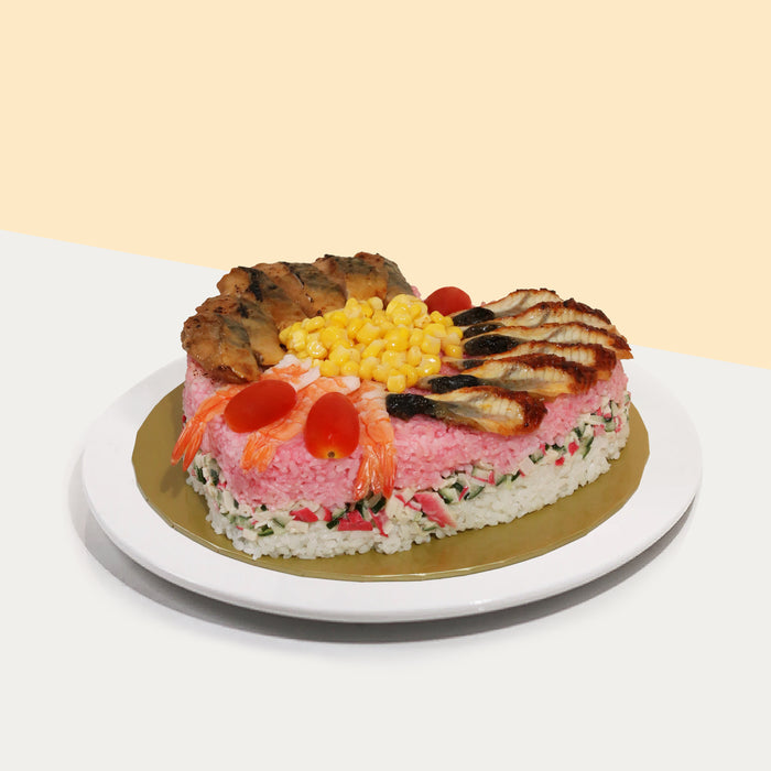 Heart shaped sushi cake, topped with prawns, unagi and teriyaki saba