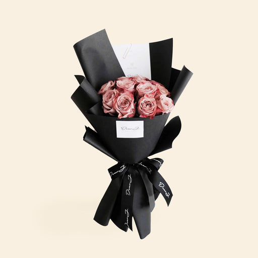 Bouquet of flowers made of Vintage Kenya Cappuccino roses, wrapped in black paper