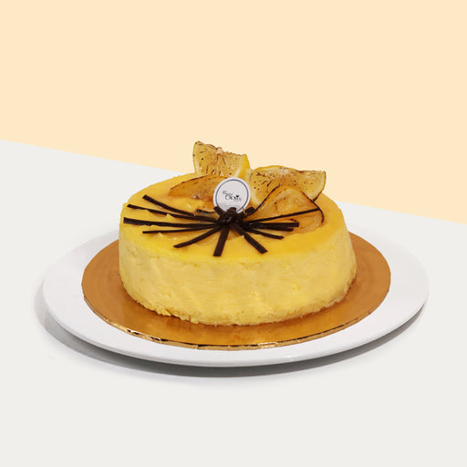 Vanilla sponge cake base, with lemon cheesecake filing, topped with lemon curd and candied lemon wedges