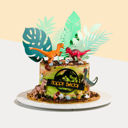 Earth coloured buttercream cake, decorated with dinosaurs and 2d printed leaves