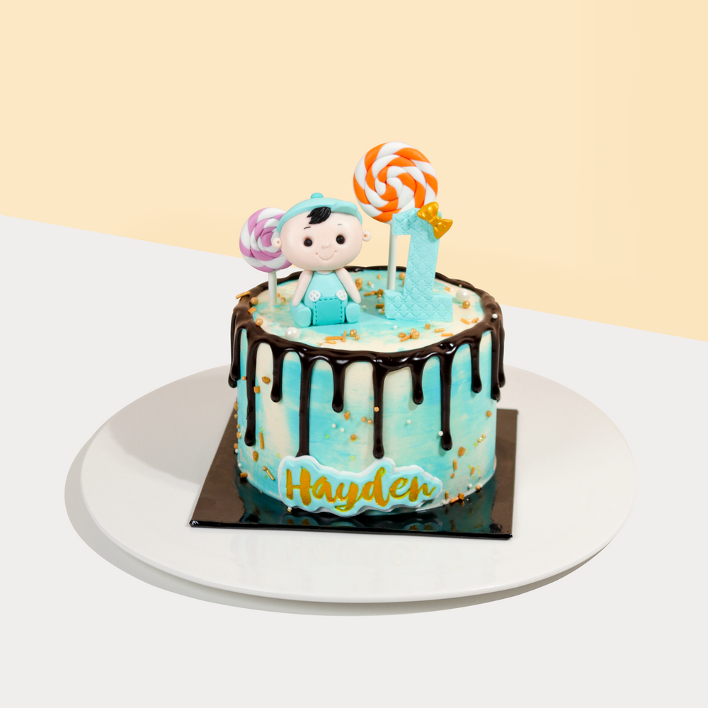 Baby boy themed cake decorated in blue