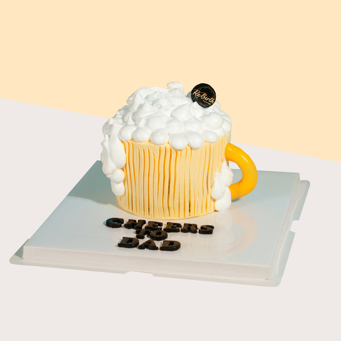 Beer mug cake, topped with cream as foam