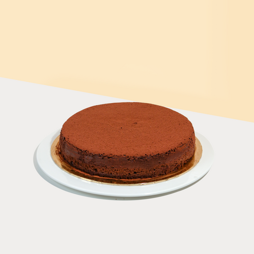 Flourless chocolate cake, dusted with chocolate powder