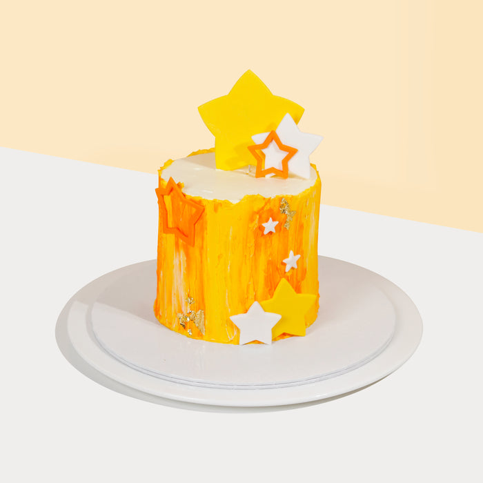 Mustard yellow buttercream cake with geometrical stars decorations