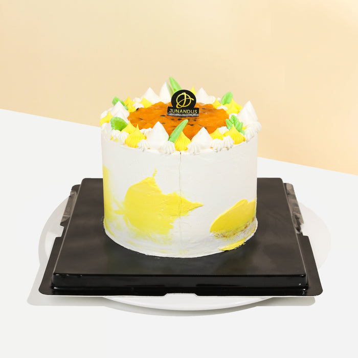 Mango and passion fruit butter cake, topped with passion fruit puree