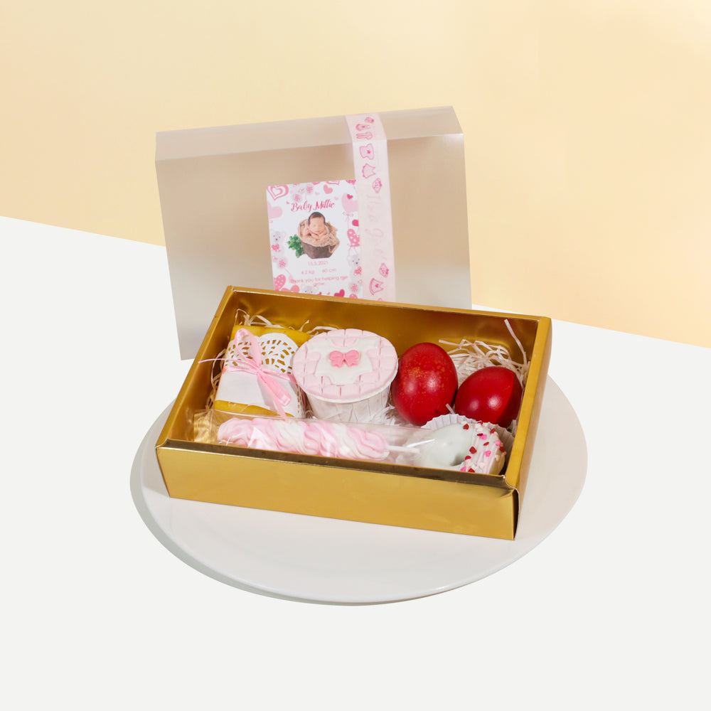 Pink themed full moon set with butter loaf, donut, cupcake, red eggs and meringue lollipops 