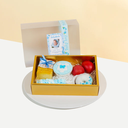 Blue themed full moon set with butter loaf, donut, cupcake, red eggs and meringue lollipops 