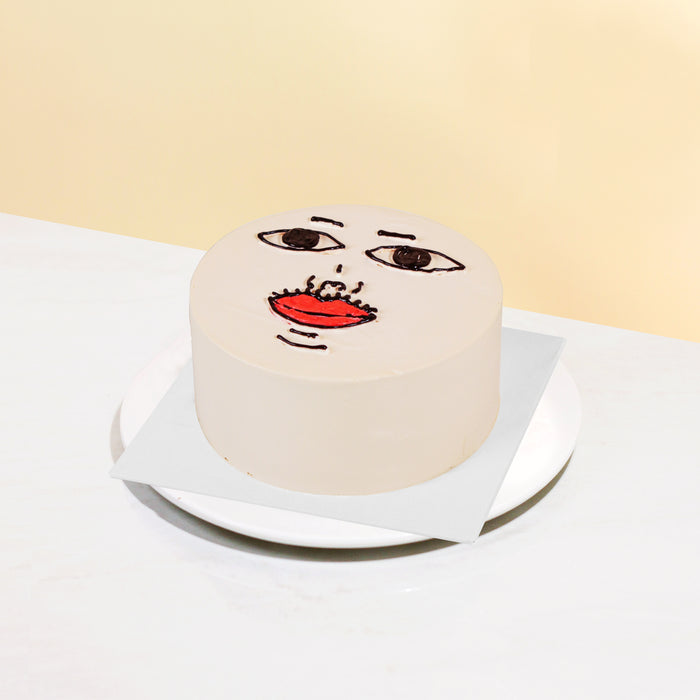 Buttercream cake with funny hand piped facial features