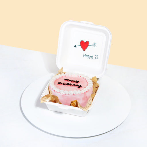 Bento cake with Korean inspired cake with pink buttercream, white hand piped cream and Happy Birthday wordings