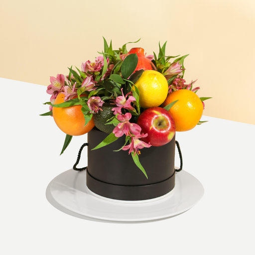 Fruits box with alstromeria flowers, in a round box