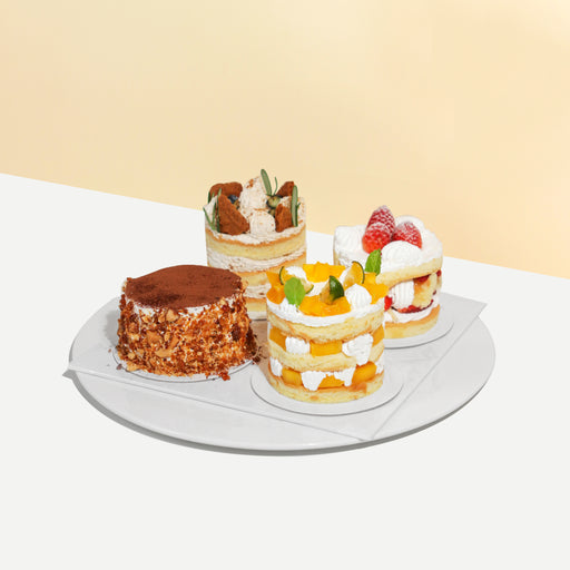 Mini cake set of four, with Tiramisu, mango, strawberry and Lotus biscoff flavours