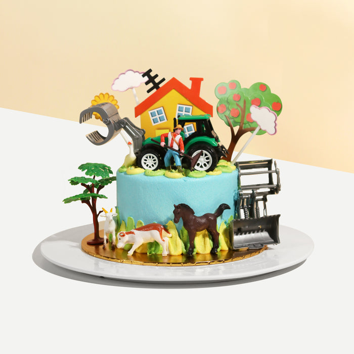 Farm themed cake, with toy tractor, farmer, horse and dog