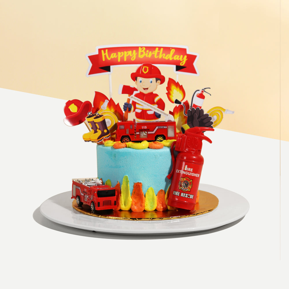 Fireman theme cake, with toy fire engines, toy fire extinguisher and 2d fireman decorations