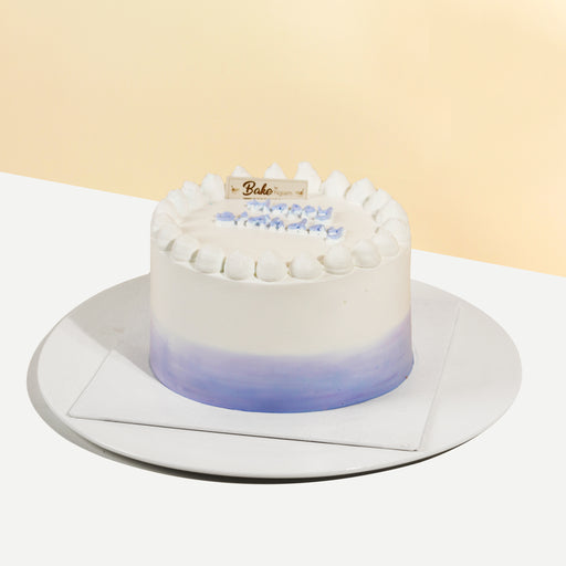 Ombre cake with purple and white accents, filled with yam