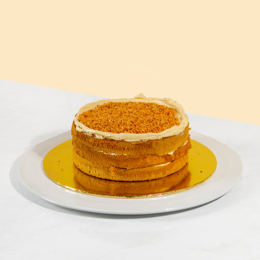 Pandan sponge cake with Gula Melaka buttercream, topped with crunchy coconut flakes