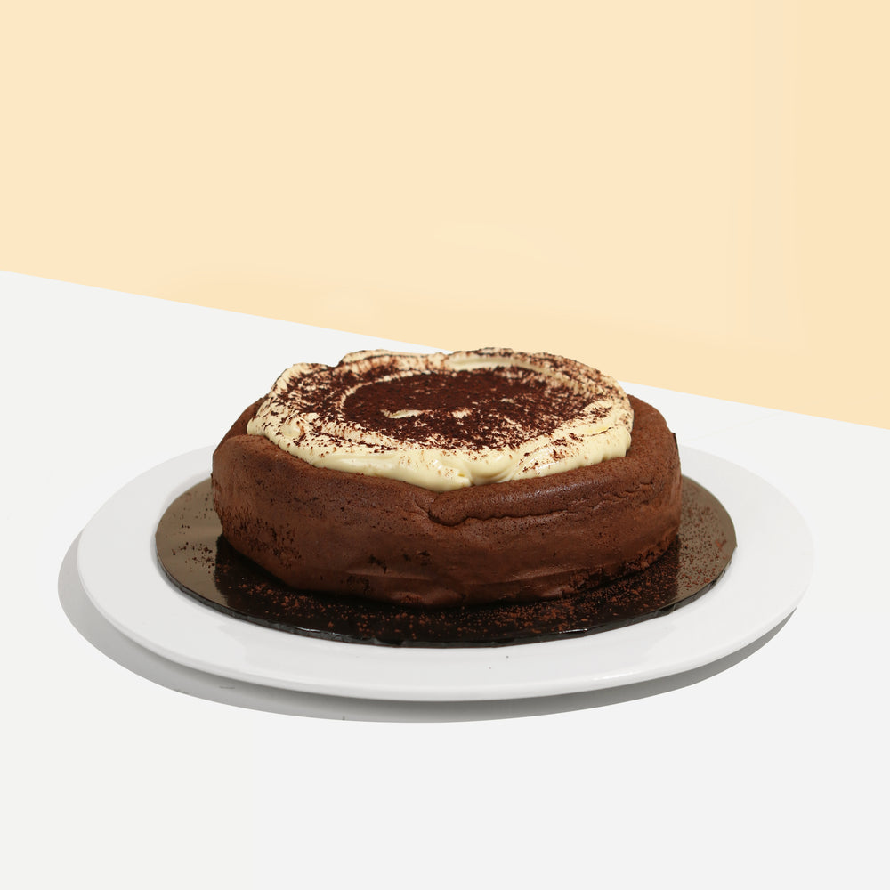 Fluffy sponge cake, with a dollop of mascarpone cheese and cocoa powder