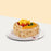 Heart shaped chiffon cake with fresh cream and almond flakes, topped with fresh fruits