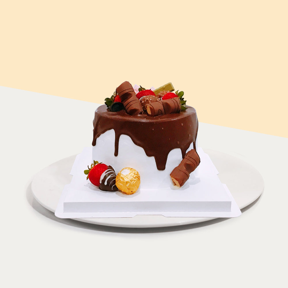 Chocolate cake with strawberry jam and Callebaut chocolate sauce