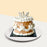 Brown Korean vintage cake with white buttercream decorations, topped with a silver crown