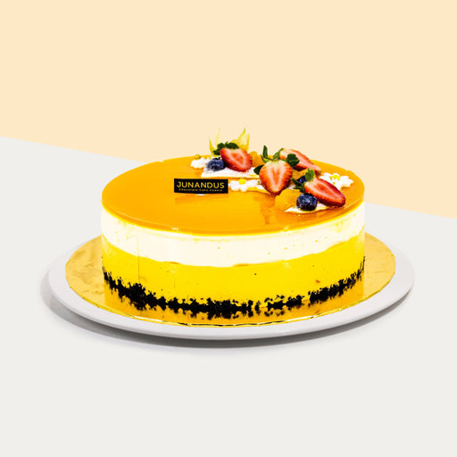 Cheesecake with a layer of jellied mango on top, along with fresh fruits