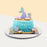 Mermaid cake with blue buttercream frills, decorated with cookies that resemble starfish, sea shells and mermaid tail