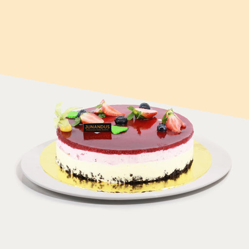 Cheese cake with Oreo base, with a mixed berries cheesecake, and topped with strawberry jelly