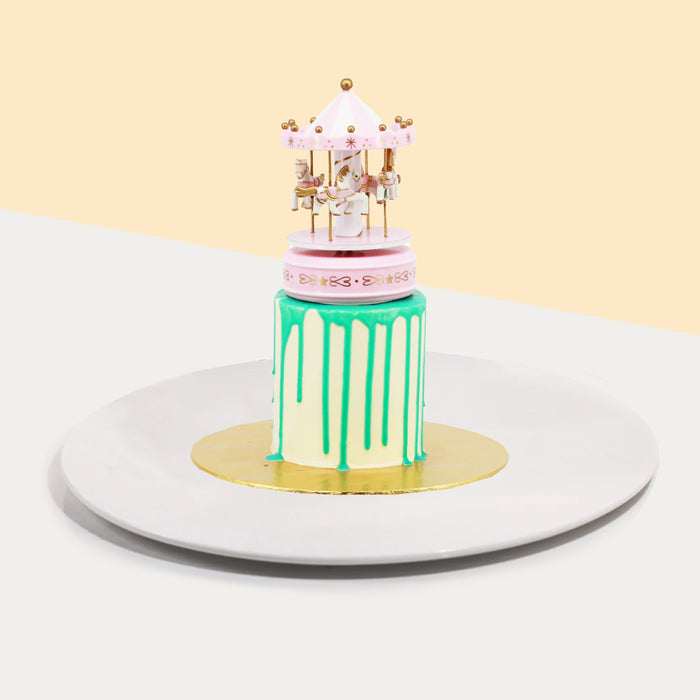 Butter cake with a musical carousel on top