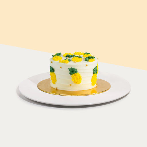 Buttercream cake with pineapple design elements