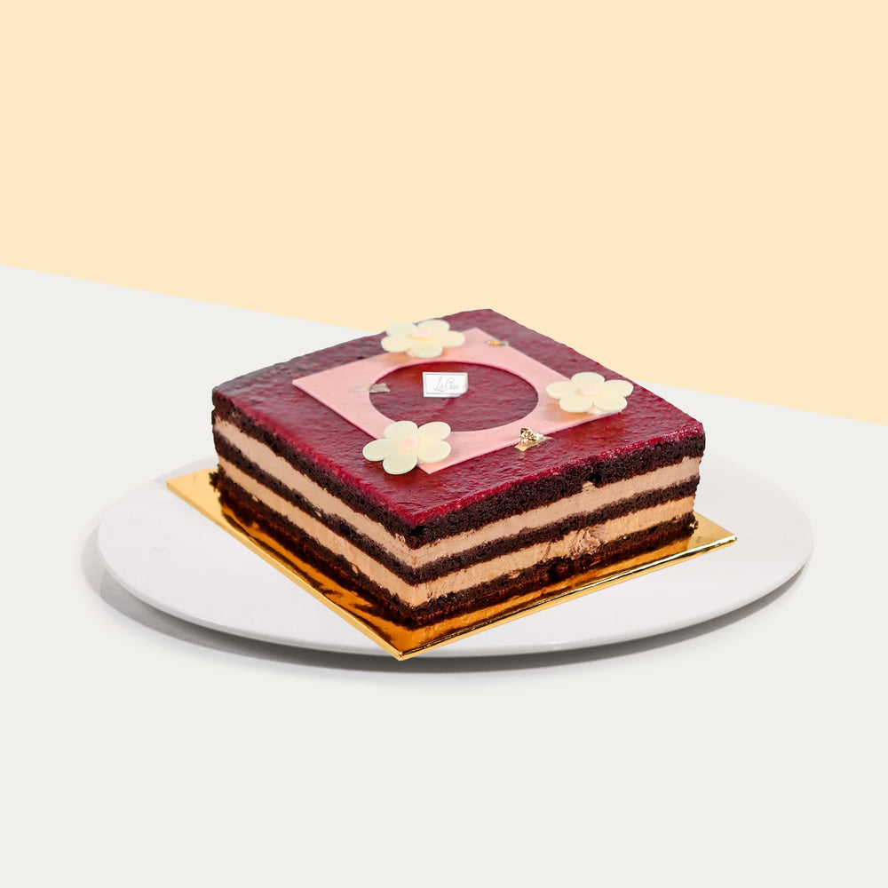 Raspberry earl grey cake with chocolate cake and chocolate mousse layers