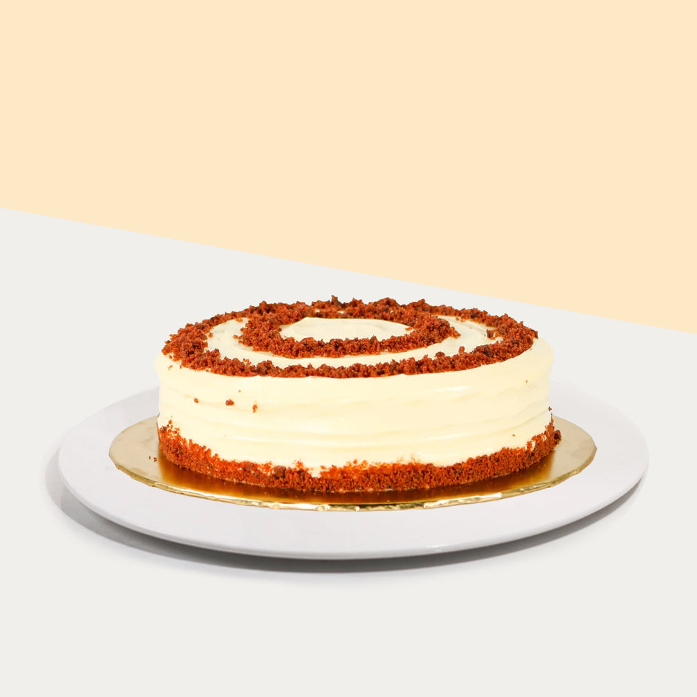 Red velvet cake with red velvet crumb spirals atop of the cake