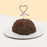 Chocolate cake filled with orange and strawberry mousse, with a heart shaped candle