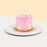 Yellow buttercream cake with pink glaze